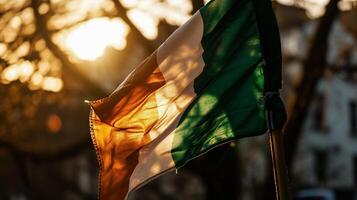 ai generiert National Flagge von Irland winken im das Wind im das Strahlen von das Rahmen Sonne foto