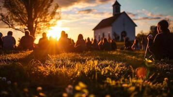 ai generiert Silhouette von Menschen Sitzung auf das Gras im Vorderseite von das Kirche beim Sonnenuntergang foto