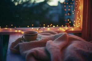 ai generiert Tasse von Kaffee eingewickelt im ein warm gestrickt Schal auf ein hölzern Terrasse im das Abend foto