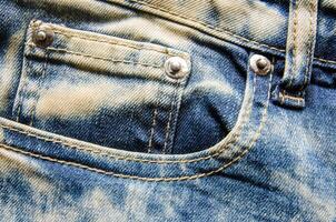 Falten Blau Jeans Textur. Jeans Hintergrund. foto