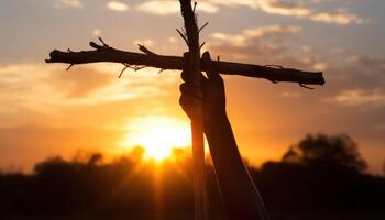 ai generiert silhouettiert Hand Griffe ein hölzern Kreuz gegen ein Sonnenaufgang Hintergrund, Palme Sonntag Sonnenaufgang Sonnenuntergang Foto