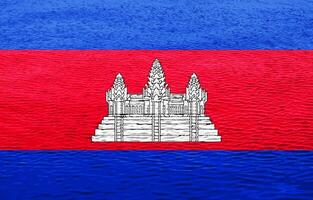 Flagge von Königreich von Kambodscha auf ein texturiert Hintergrund. Konzept Collage. foto