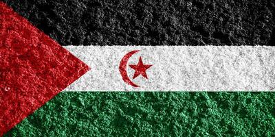 Flagge von Western Sahara auf ein texturiert Hintergrund. Konzept Collage. foto