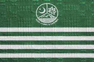 Flagge von und Mantel azad Kaschmir auf ein texturiert Hintergrund. Konzept Collage. foto