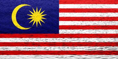 Flagge von Malaysia auf ein texturiert Hintergrund. Konzept Collage. foto