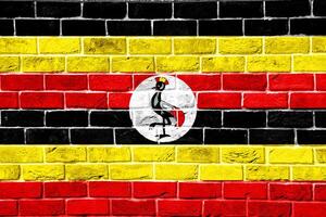 Flagge von Republik von Uganda auf ein texturiert Hintergrund. Konzept Collage. foto