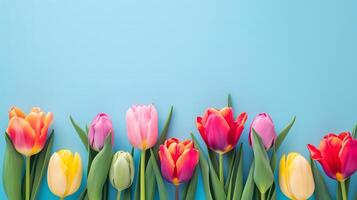 ai generiert Blumen- Frühling Hintergrund mit Rand von bunt Tulpen auf Licht Blau Hintergrund. Kopieren Raum. foto