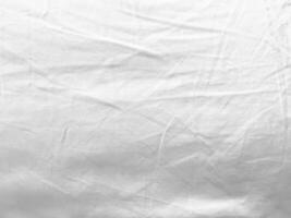 das Linie und Muster von diese seidig, Weiß Stoff erstellen ein visuell reizvoll Textur, verbessern das insgesamt ästhetisch und Bereitstellung ein Sinn von Raffinesse. foto