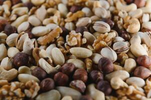 Hintergrund von verschiedene Nüsse Mandel, Cashew, Haselnuss, Pistazie, Nussbaum. Vegetarier Mahlzeit. gesund Essen Konzept foto