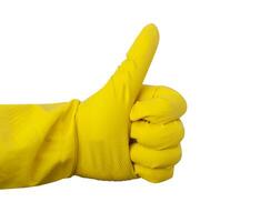 Gelb Gummi Handschuh zum Reinigung zeigt an ein Geste auf ein Weiß foto