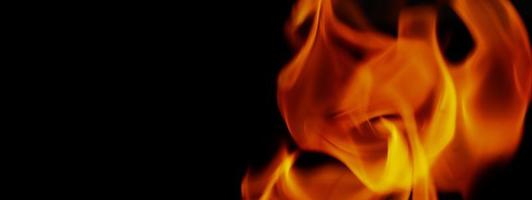 Feuer Hintergrund. abstrakte brennende Flamme und schwarzer Hintergrund. foto
