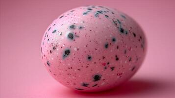 ai generiert ein Rosa und schwarz Ei ordentlich vereinbart worden auf ein Rosa Oberfläche. foto