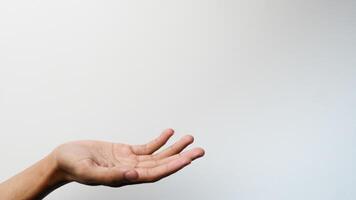 des Mannes Hand mit ein Geste fragen zum Geld auf ein Weiß Hintergrund foto