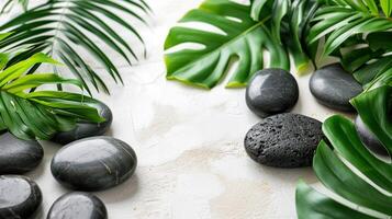 ai generiert Massage Blätter und schwarz Steine auf ein Weiß Hintergrund foto