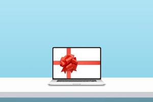 Laptop mit Band und Schleife auf dem Display. minimales Konzept des Weihnachtseinkaufs foto