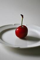 ai generiert ein Single rot Apfel Sitzung auf ein Weiß Teller foto