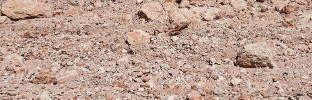 Wüste Bett von ein geschmolzen Gletscher gemacht von rötlich Steine, erinnernd von ein Marsmensch Landschaft foto
