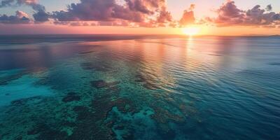 ai generiert großartig Barriere Riff auf das Küste von Queensland, Australien Meereslandschaft. Koralle Meer Marine Ökosystem Hintergrund Hintergrund beim Sonnenuntergang, mit ein Orange lila Himmel im das Abend golden Stunde foto