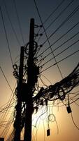 elektrisch Pole während Sonnenuntergang foto