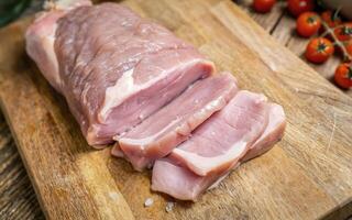 ai generiert ein frisch Stück von roh Schweinefleisch auf ein Schneiden Tafel foto