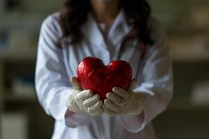 ai generiert ein weiblich Arzt halten ein rot Herz foto
