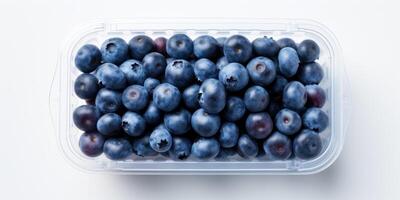 ai generiert reif Blaubeeren im transparent Plastik Container auf Weiß Hintergrund. frisch Beere Pack, Heidelbeere Paket. generativ ai foto