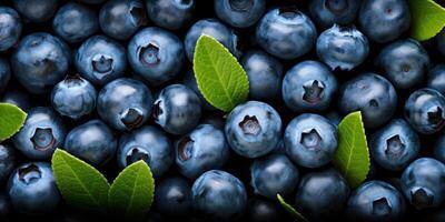 ai generiert oben Aussicht von reif Beeren Haufen. Nahansicht von Blaubeeren Haufen mit Grün Blätter. Essen Hintergrund. generativ ai foto