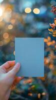 ai generiert Hand halten leer Blau Papier mit ein Sanft Bokeh Hintergrund Vertikale Handy, Mobiltelefon Hintergrund foto