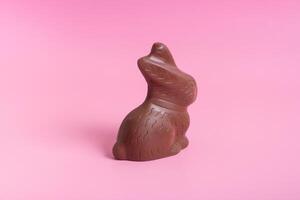 Schokolade Hase Symbol zu Ostern Ferien auf ein Rosa Hintergrund foto