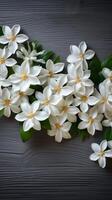 ai generiert Eleganz im Einfachheit Weiß Jasmin Blumen auf hölzern Hintergrund Vertikale Handy, Mobiltelefon Hintergrund foto