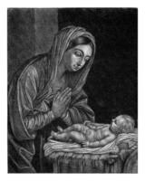 Maria verehrend das Christus Kind foto