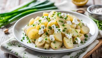 ai generiert hausgemacht klobig Kartoffel Salat mit Frühling Zwiebeln Lauchzwiebel, Zitrone Zitrusschale, Pfeffer, Feta Käse und Senf Joghurt Soße foto