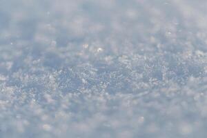 Schnee Textur Makro mit Schneeflocken. Winter Hintergrund foto