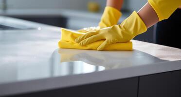 ai generiert Frau Reinigung mit Gelb Handschuh und Schwamm auf das Zähler foto