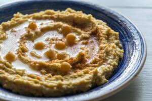 Portion von Hummus foto