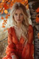 ai generiert schön blond Frau im rot orange Kleid posieren durch Baum mit bunt Blätter foto