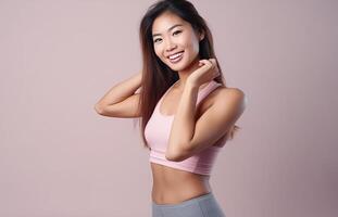 ai generiert schön jung asiatisch Frau präsentieren Stärke und Entschlossenheit im dynamisch trainieren Posen, Fitness Sitzung, isoliert gegen ein Studio Hintergrund foto