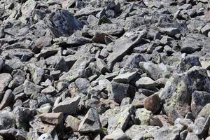 texturiert Rau Felsen mit Menge von klein Einzelheiten foto