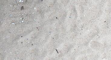 schließen oben von Sand Muster auf Strand Hintergrund, Natur und Umgebung Konzept foto