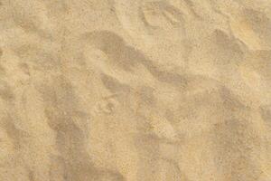 Strand Sand Hintergrund, texturiert Küsten Glückseligkeit foto