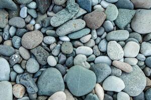 abstrakt Hintergrund mit trocken runden peeble Steine. Meer Stein schließen oben foto