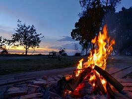 ai generiert Lagerfeuer unter das Sterne foto