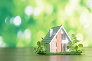ai generiert Zuhause Träume klein Modell- Haus gegen Grün Bokeh Hintergrund foto