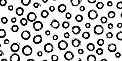künstlerisch Bürste Schlaganfälle, Hand gemalt Kreise im nahtlos schwarz und Weiß Muster gegen abstrakt Hintergrund. foto