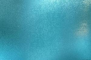 brillant blaugrün Metall Mauer Textur mit ein abstrakt Muster Hintergrund. foto