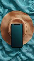 ai generiert Hut, Zelle Telefon, und Ohr Knospen auf Blau Hintergrund foto