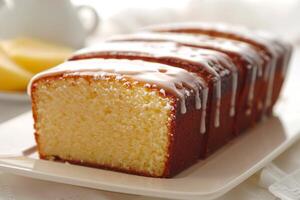 ai generiert Madeira Kuchen Dessert mit Zitrone Glasur auf ein glasiert Laib ist ein traditionell Süss backen foto