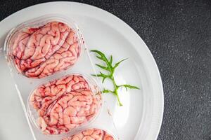 Schweinefleisch Gehirne roh essbar Innereien Fleisch frisch Essen lecker frisch gesund Essen Kochen Vorspeise Mahlzeit Essen Snack auf das Tabelle Kopieren Raum Essen Hintergrund foto