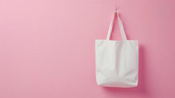 ai generiert Weiß Textil- Einkaufen Tasche hängend auf ein Rosa Mauer foto