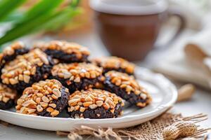 ai generiert Kukis kacang Schokolade. Schokolade Erdnuss Kekse. indonesisch eid Kekse kue Lebaran foto